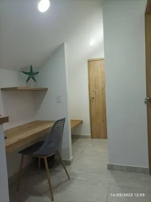 a room with a chair and a table and a star at Apto Nuevo, Tranquilo, Bonito, 5 min Plaza Principal in Guatapé