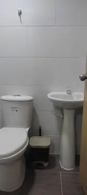 a bathroom with a toilet and a sink at HABITACIÓN independiente con COCINA EN LAURELES ESTADIO para 3 personas in Medellín