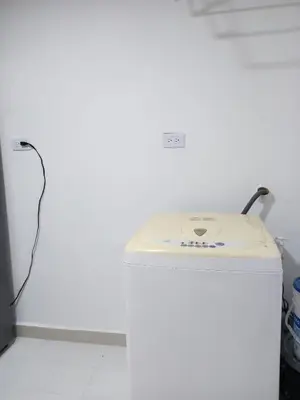 a fax machine sitting on top of a white wall at Lindo y acogedor apto cerca Mall Hospitales U Autónoma in Manizales