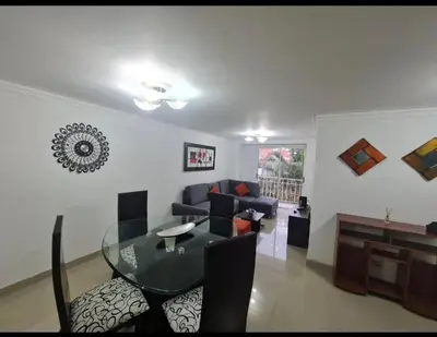 a living room with a glass table and a couch at Apartamento en envigado in Envigado