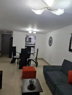 a living room with a couch and a table at Apartamento en envigado in Envigado