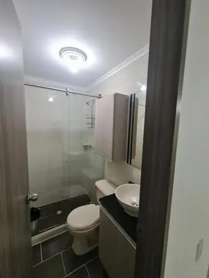 a small bathroom with a toilet and a sink at Apartamento en envigado in Envigado