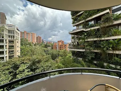 a balcony with a view of a city with tall buildings at Nature and calm in El Poblado 505 in Medellín