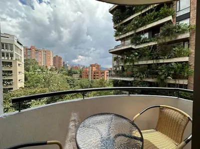 a balcony with a table and chairs on a building at Nature and calm in El Poblado 505 in Medellín