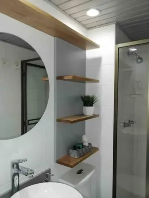 a bathroom with a sink and a mirror and a shower at Nature and calm in El Poblado 505 in Medellín