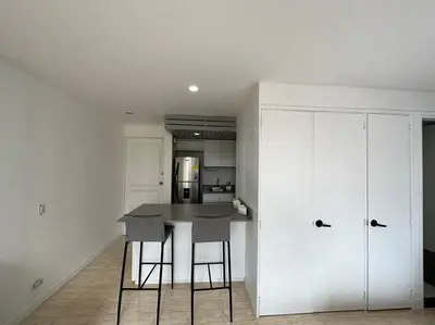 a kitchen with a table and chairs in a room at Nature and calm in El Poblado 505 in Medellín