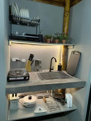 a kitchen counter with a sink and a sink at Loft bambu in Envigado