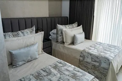 a bedroom with two beds with pillows at Apartamentos Gema Lujosos en Laureles in Medellín