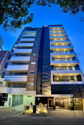 a tall building with lights in front of it at Apartamentos Gema Lujosos en Laureles in Medellín