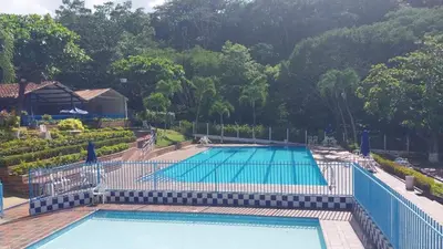 a large swimming pool in a resort at Cabaña Campestre in La Pintada