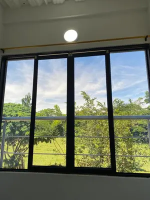 a window in a room with a view of a field at APARTAMENTO vista VERDE DORADAL in Doradal