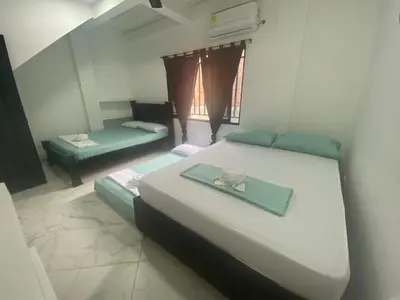 a bedroom with two beds with a tray on it at APARTAMENTO vista VERDE DORADAL in Doradal