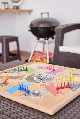 a wooden board with a game on it on a table at 5STARHOMES - Hermosa casa con terraza en Laureles in Medellín
