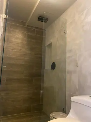 a bathroom with a shower with a toilet at Sage house de 2 alcoba la 70 laurles estadio in Medellín